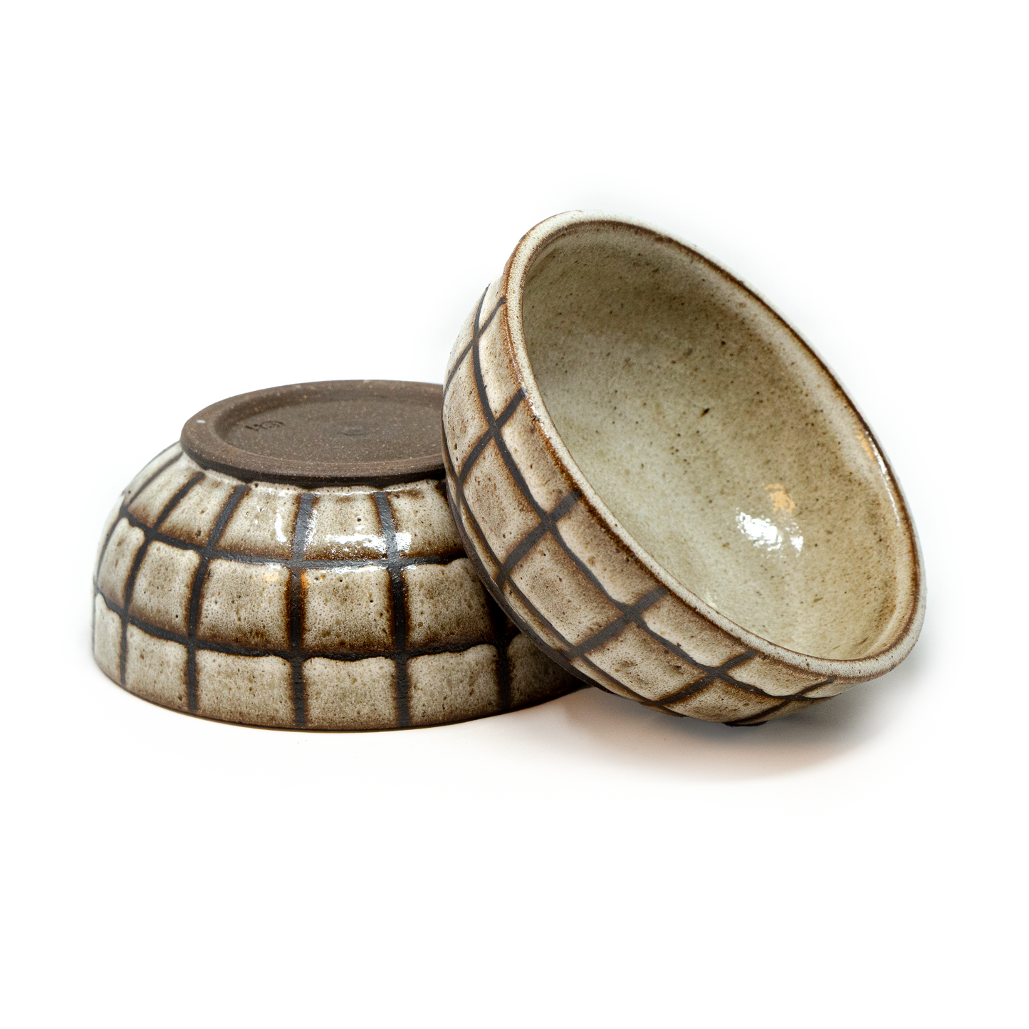 2 brown checkered ceramic bowls by a hill studio