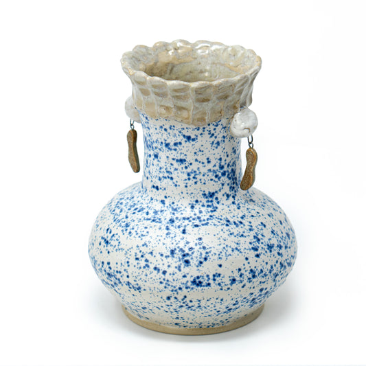 white and blue speckled ceramic vase by a hill studio