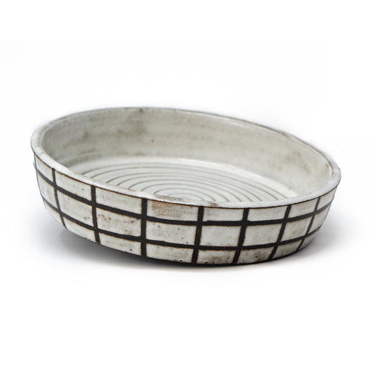 white and brown checkered dish by a hill studio