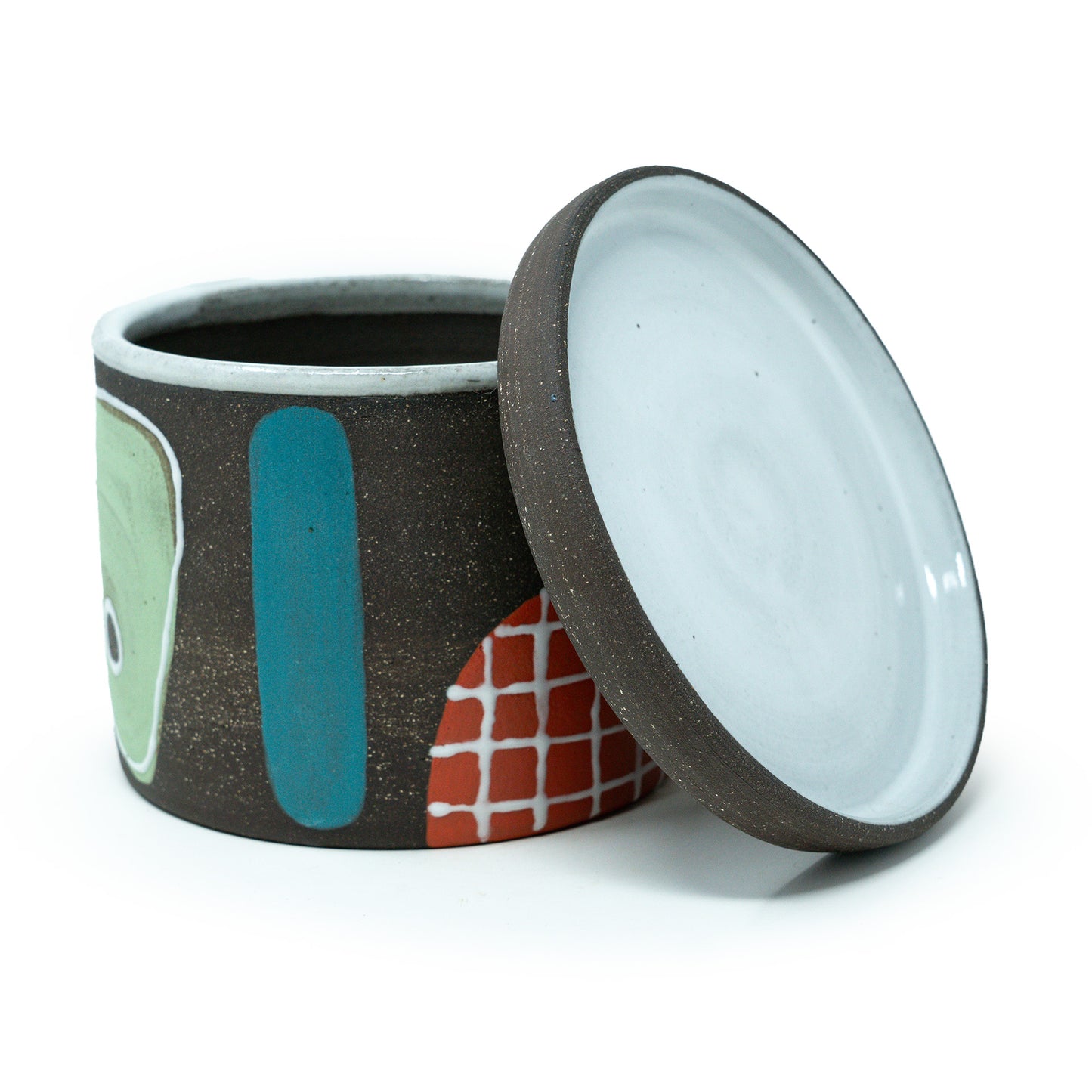 Ceramic planter with abstract design on a white background