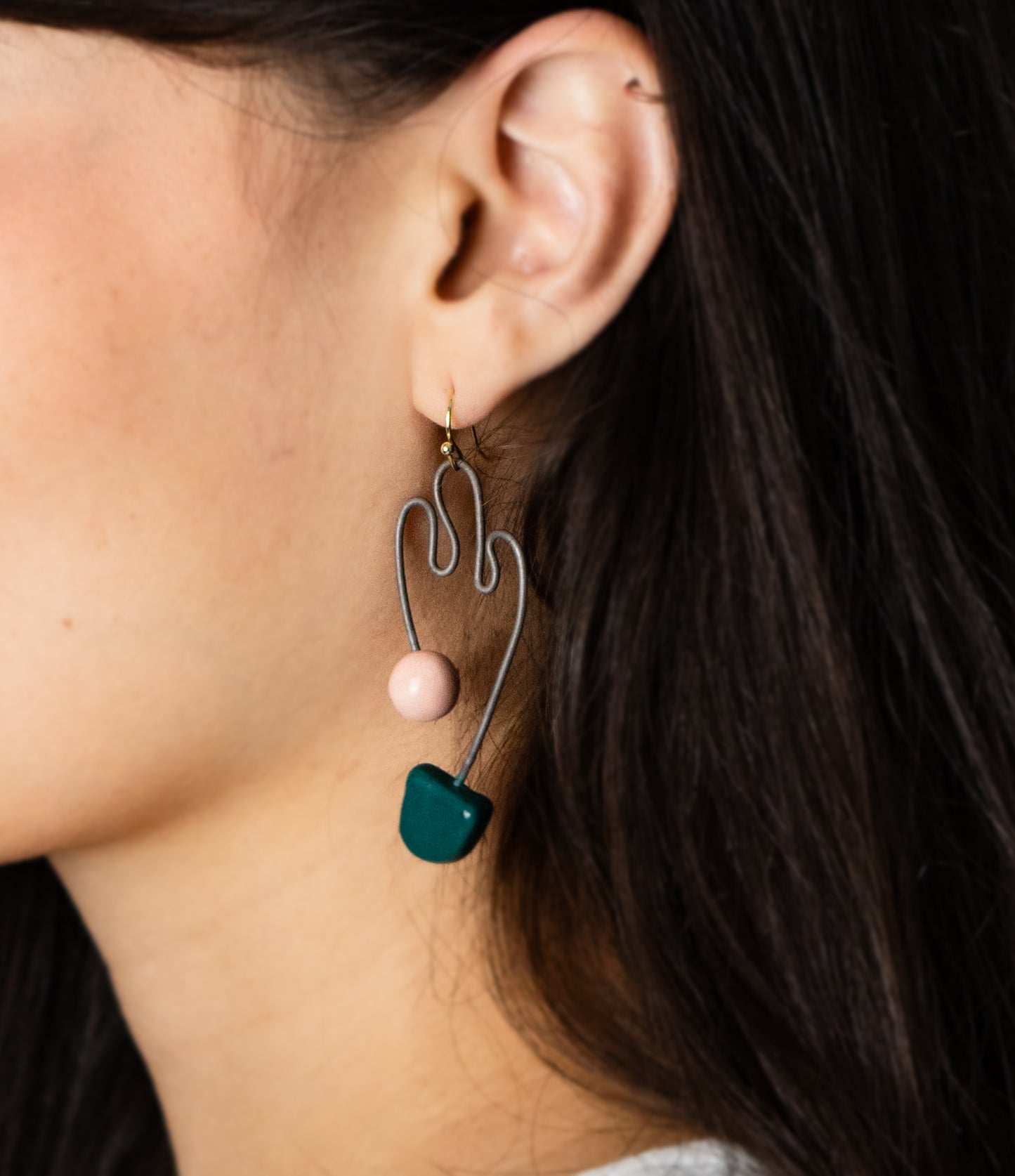 women wearing funky earings